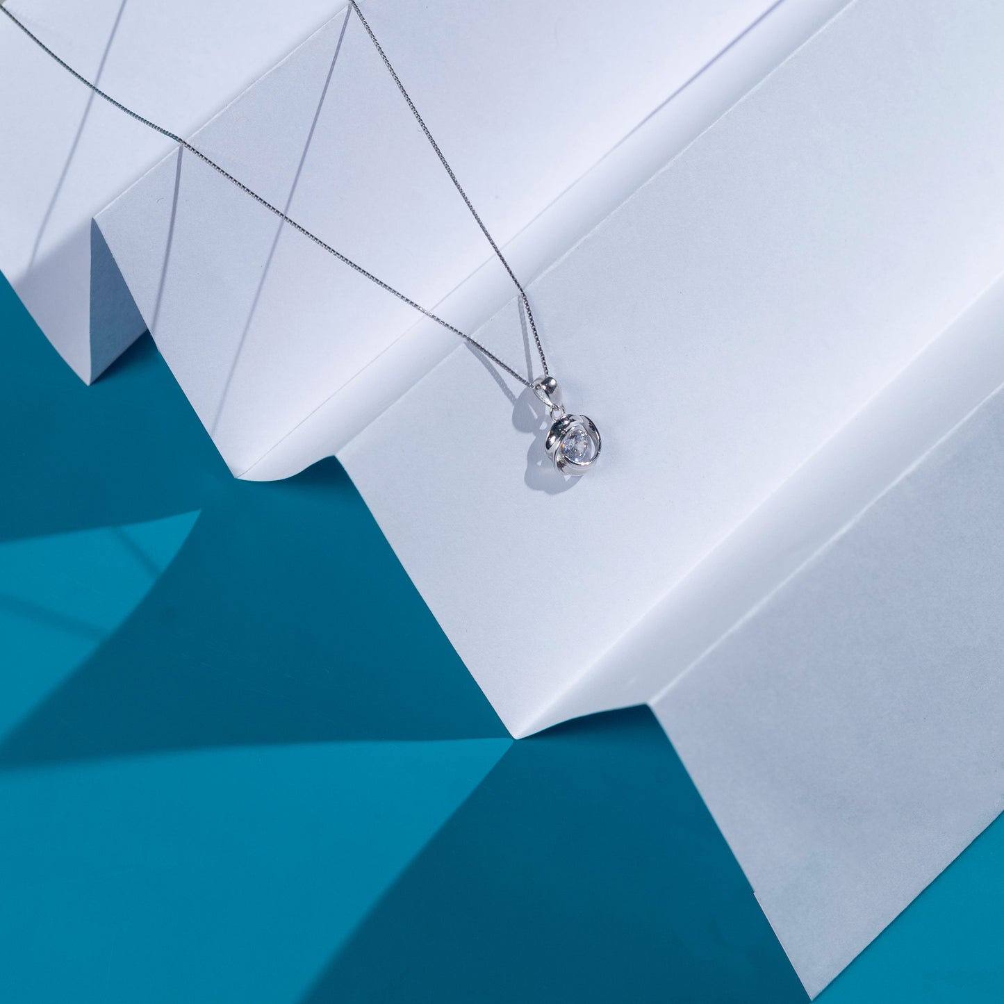 Elegant Silver Whirling Charm Necklace