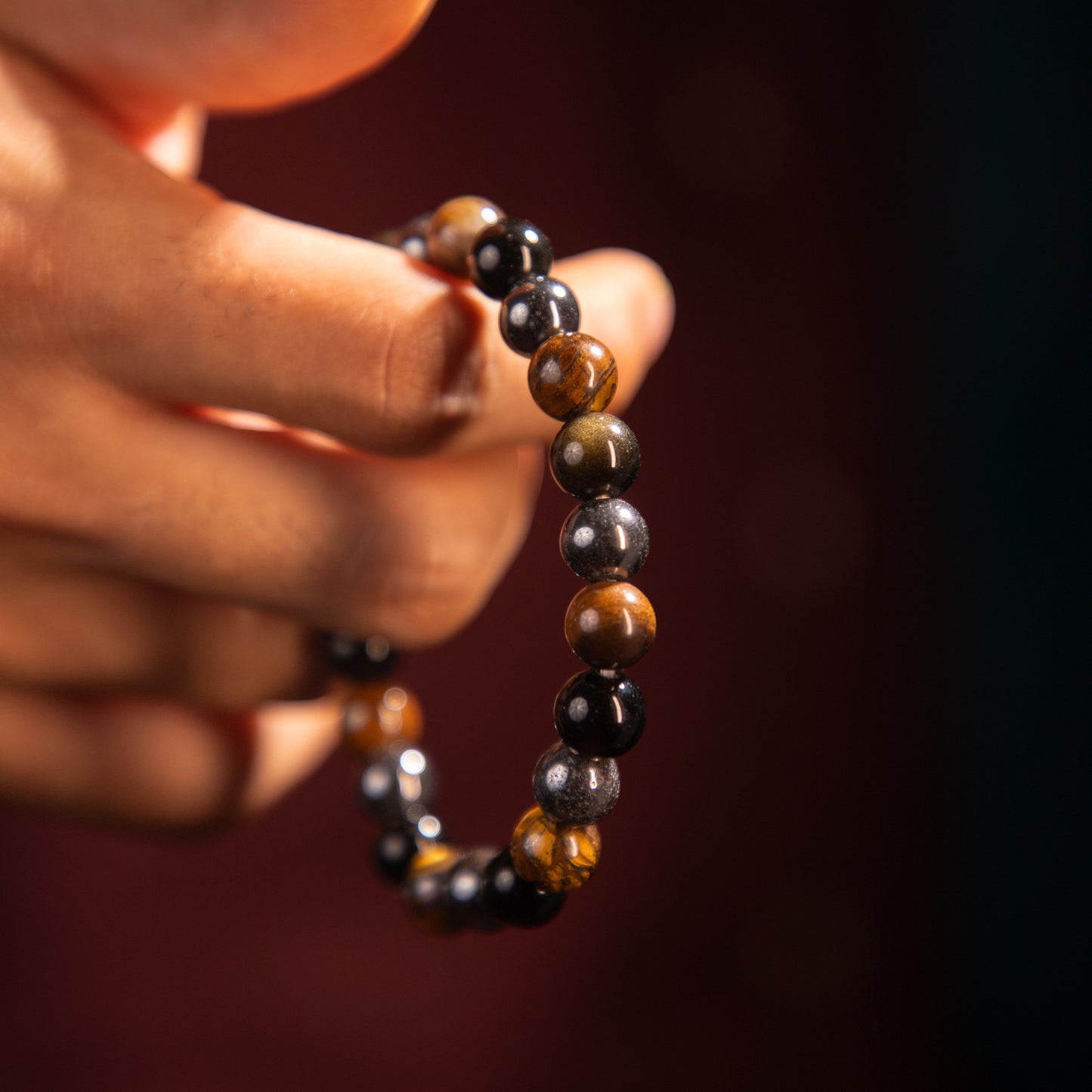 This contains tiger eye, hematite and black tourmaline and makes triple protection.