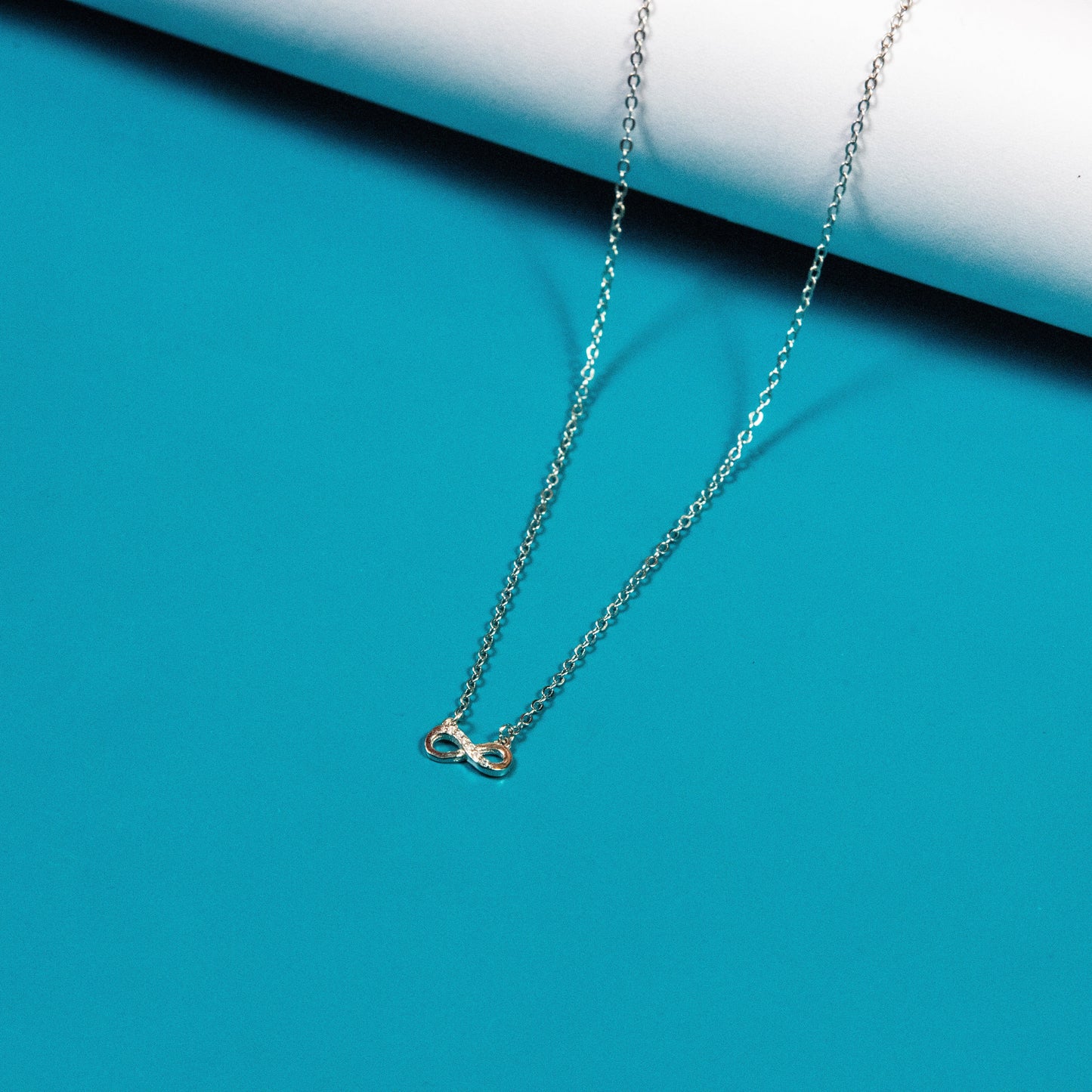 Enchanting silver infinity necklace piece