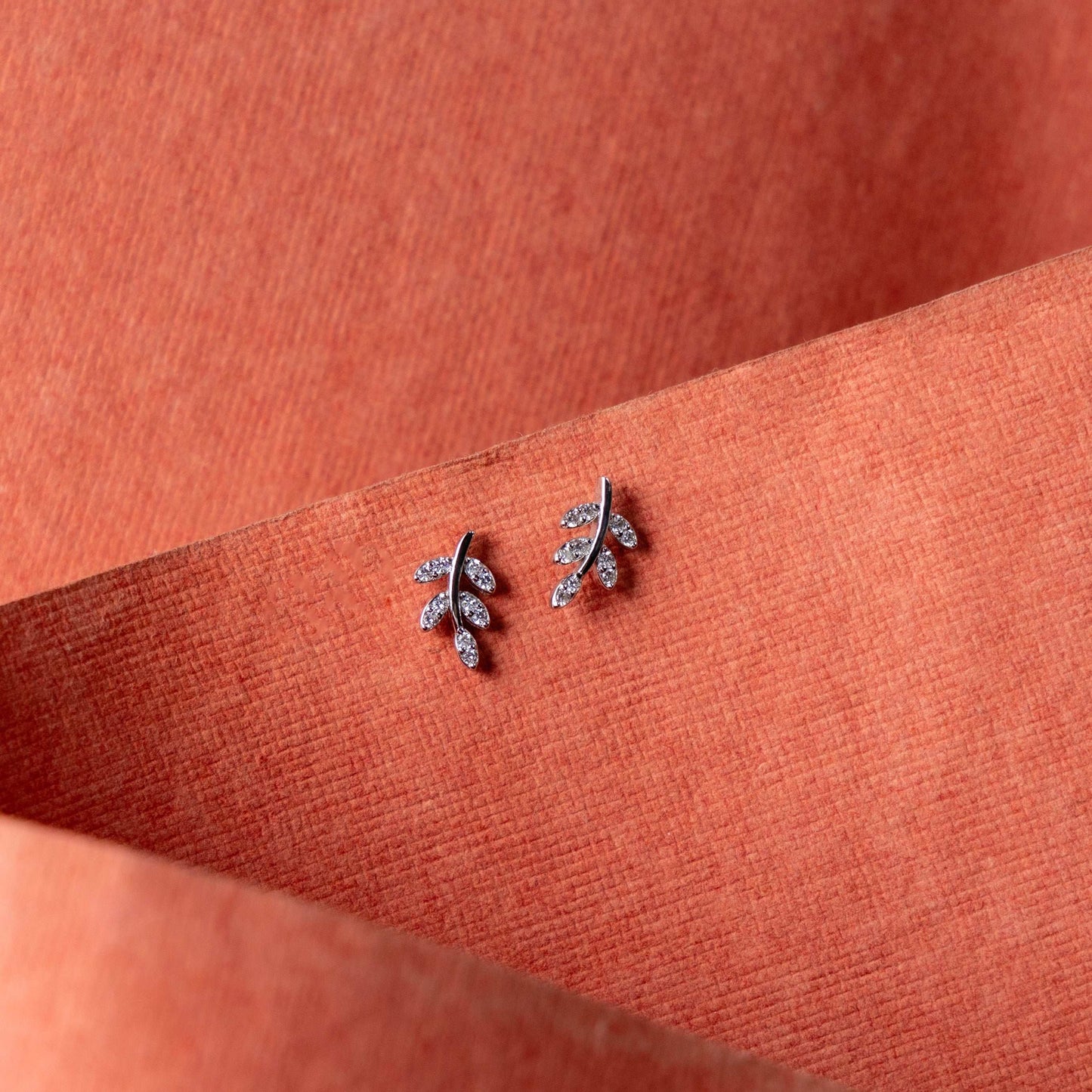Sparkling silver leaf-shaped stud earrings