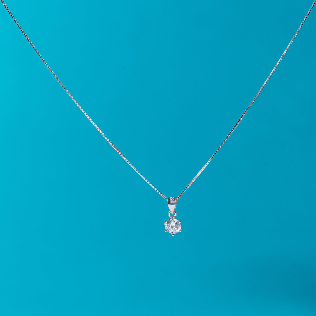 Lustrous silver necklace with solitaire charm