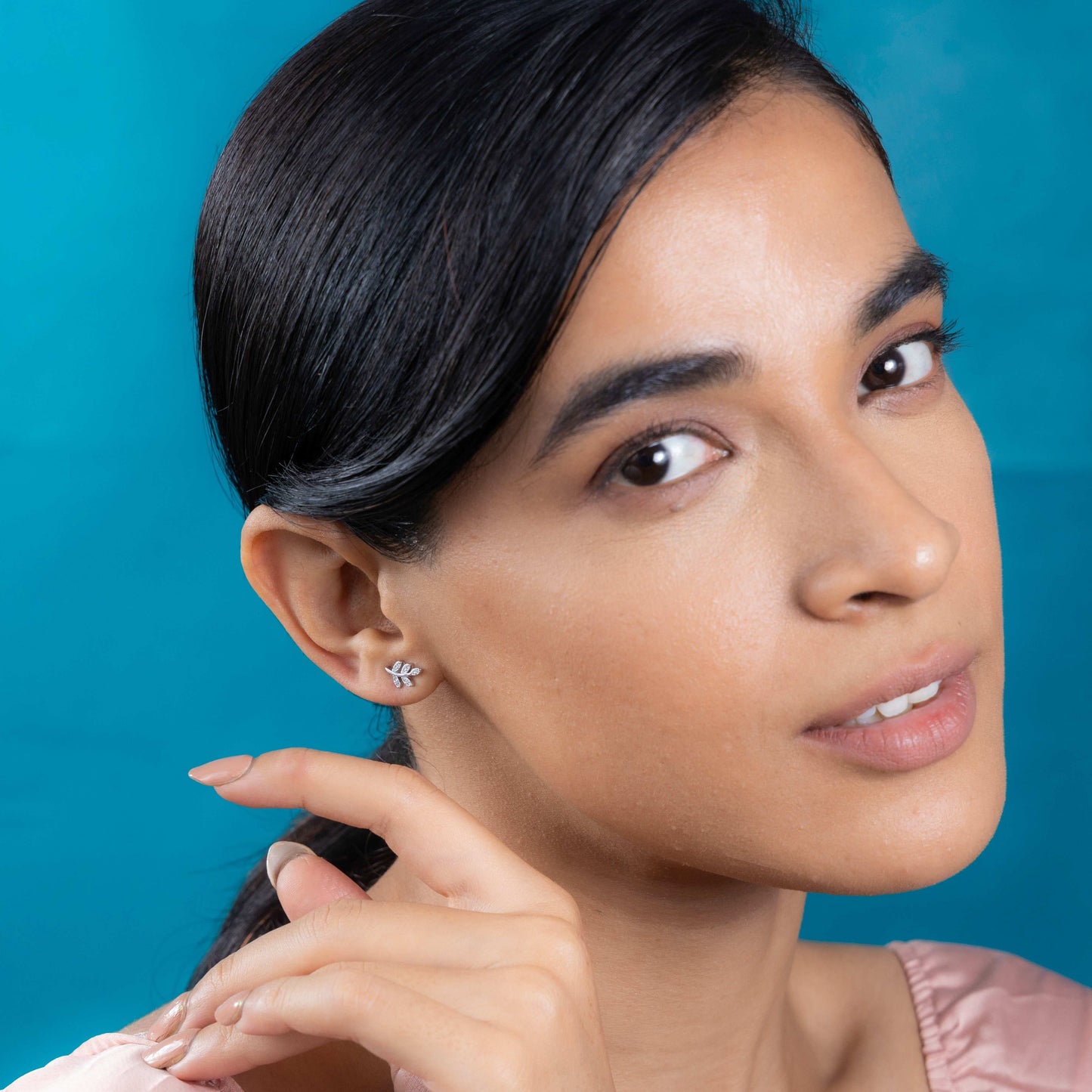 Shimmering silver leaf motif stud earrings