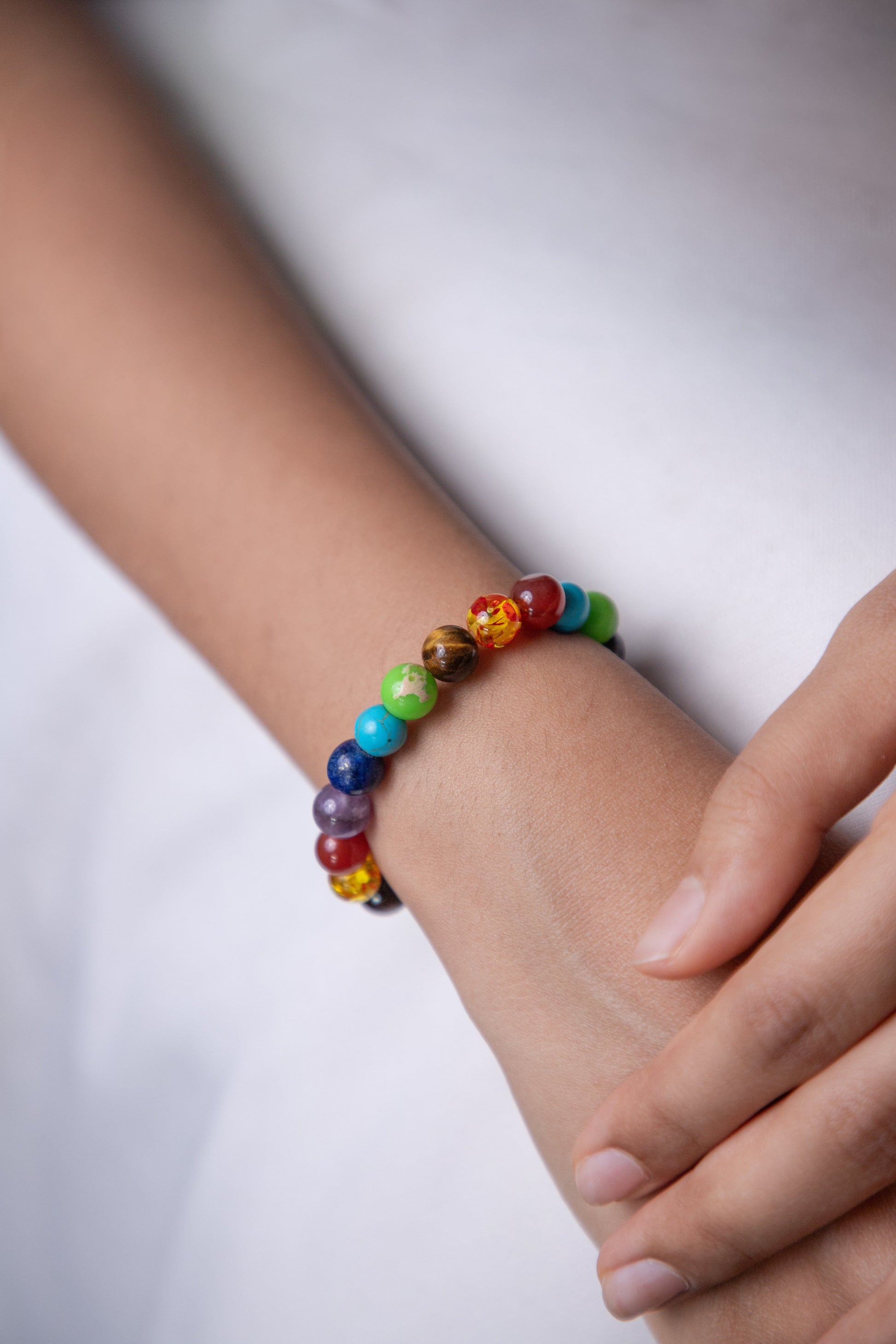 colorful beads, i.e., a 7-chakra bracelet for men and women