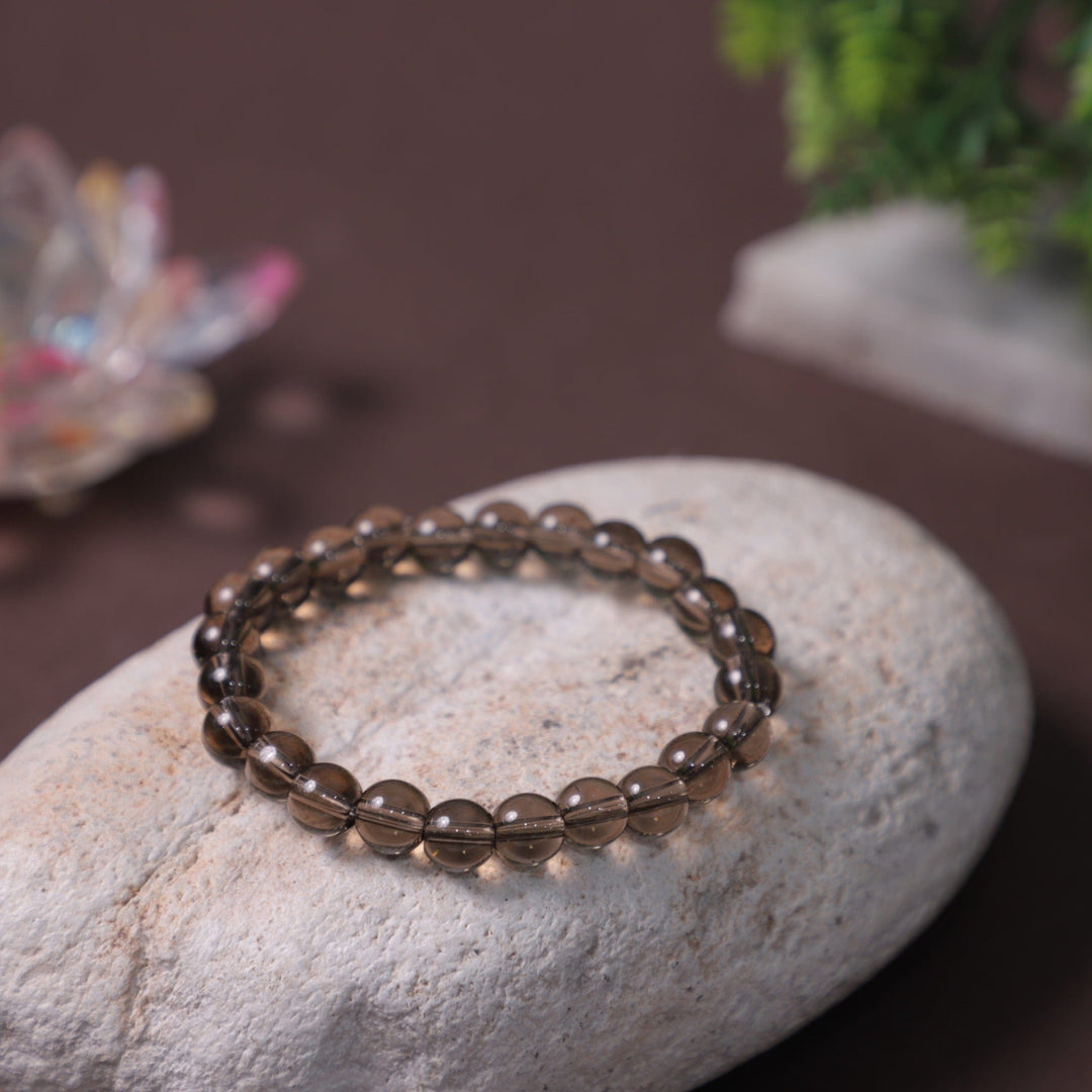 This is a smoky quartz crystal bracelet for men and women.