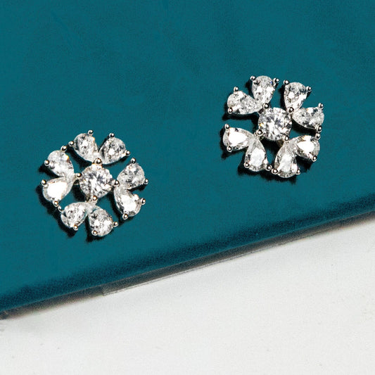 Charming silver floral shaped studs